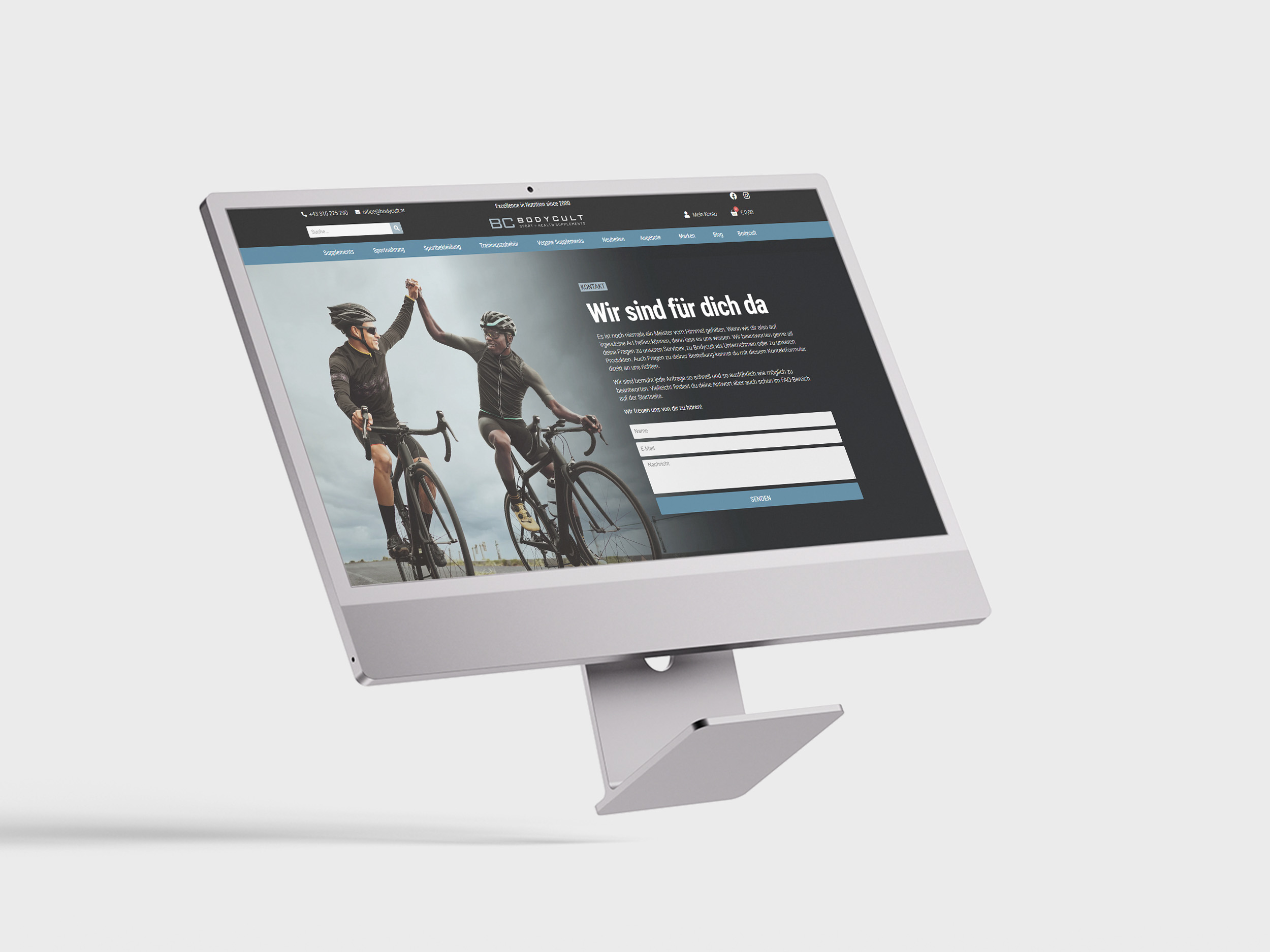 Ein Apple Mac, auf dessen Bildschirm die Kontaktseite zu sehen ist